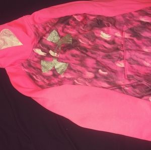 A pink cancer awareness under armour hoodie.